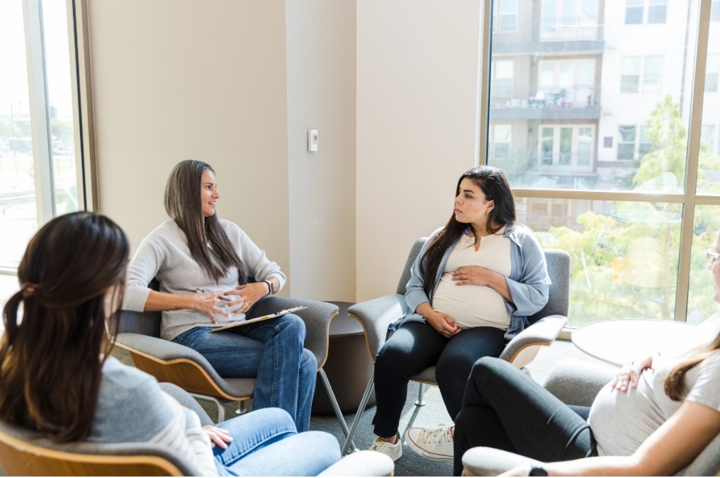 Pregnant woman receiving support at home